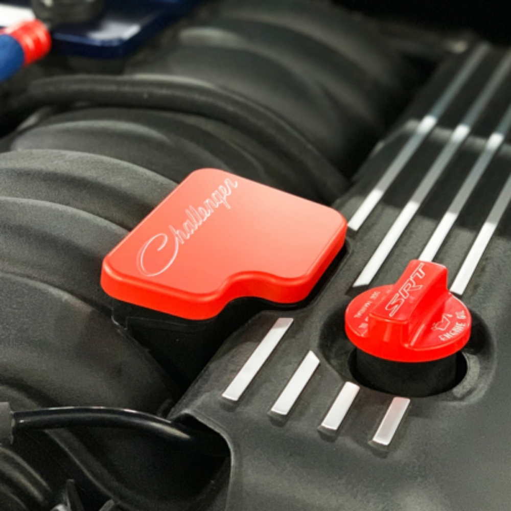 Stylish and durable manifold baffle cover for the 2021+ Jeep Wrangler JLU 392, shown in orange.